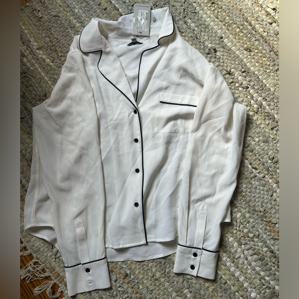 White blouse with black detailing.